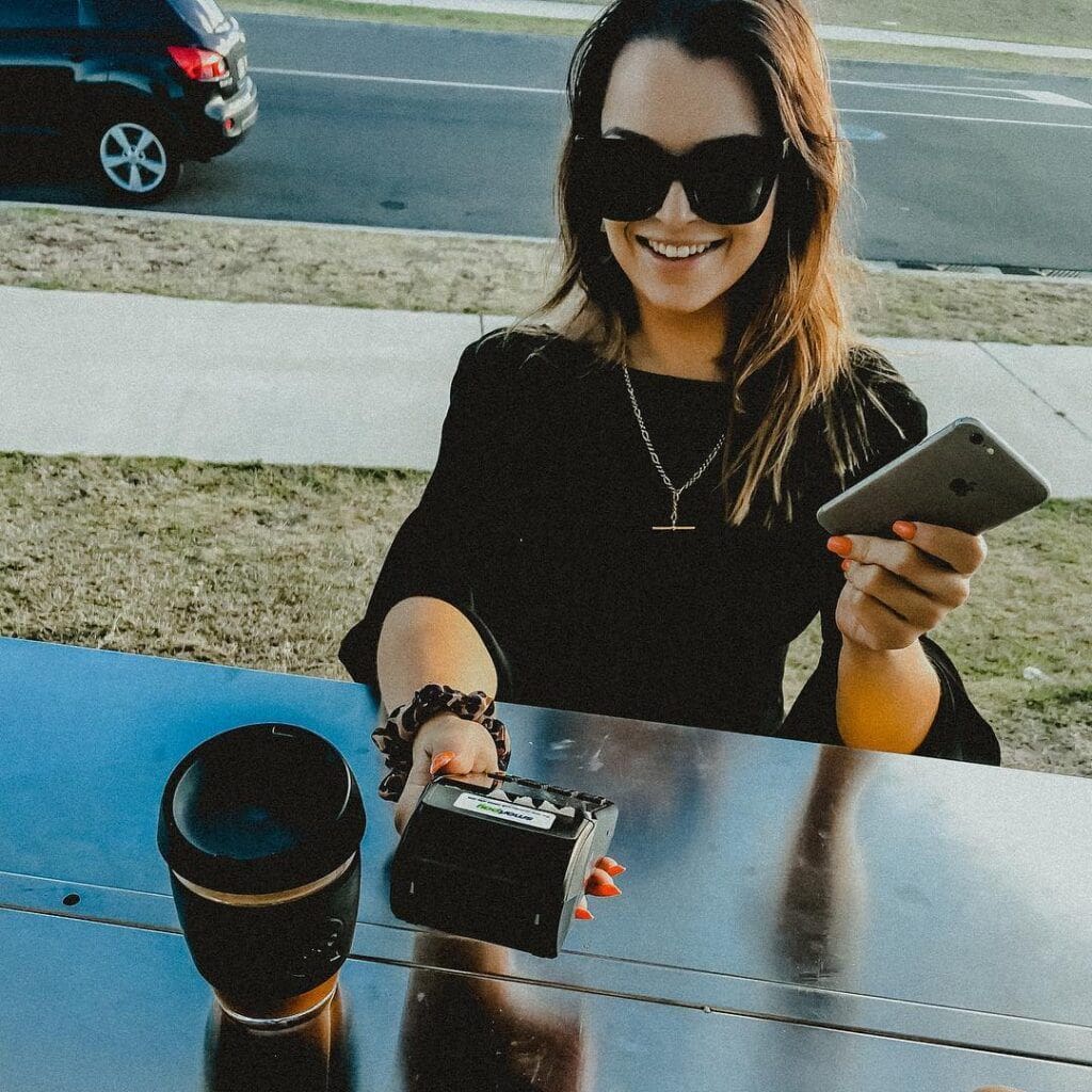 Woman paying for coffee