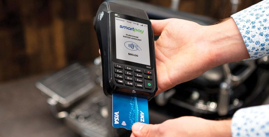 Card inserted in EFTPOS machine with payment screen