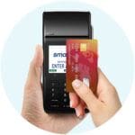 Hand paying with card on EFTPOS terminal