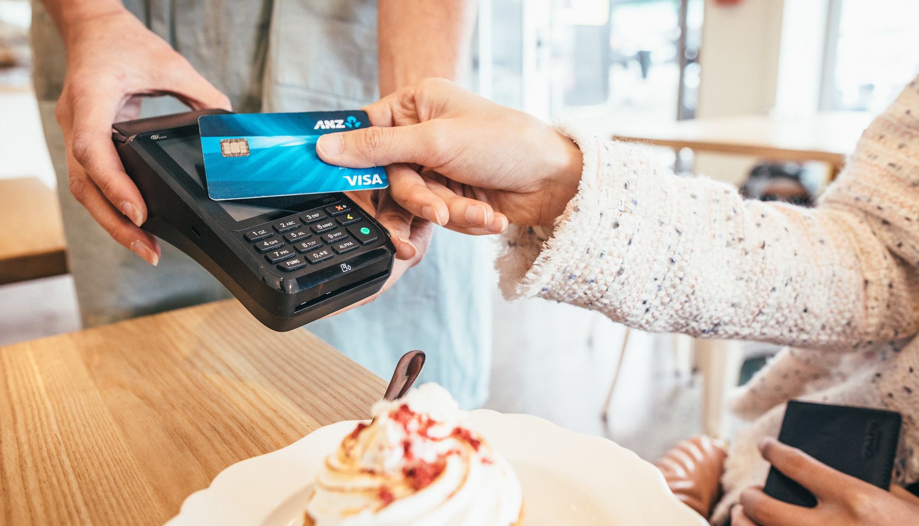 Lady paying for pastry