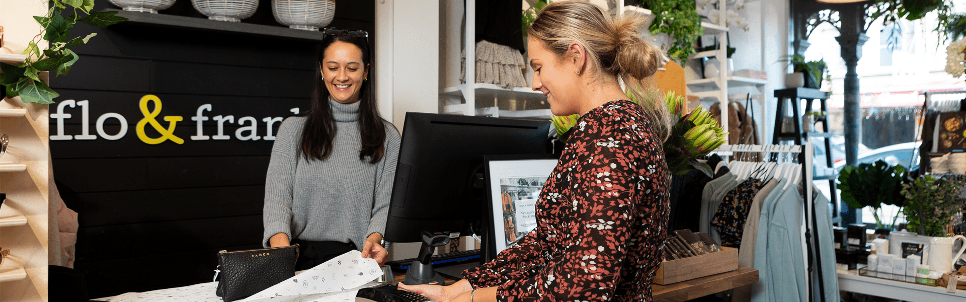 Lady paying for bag at counter