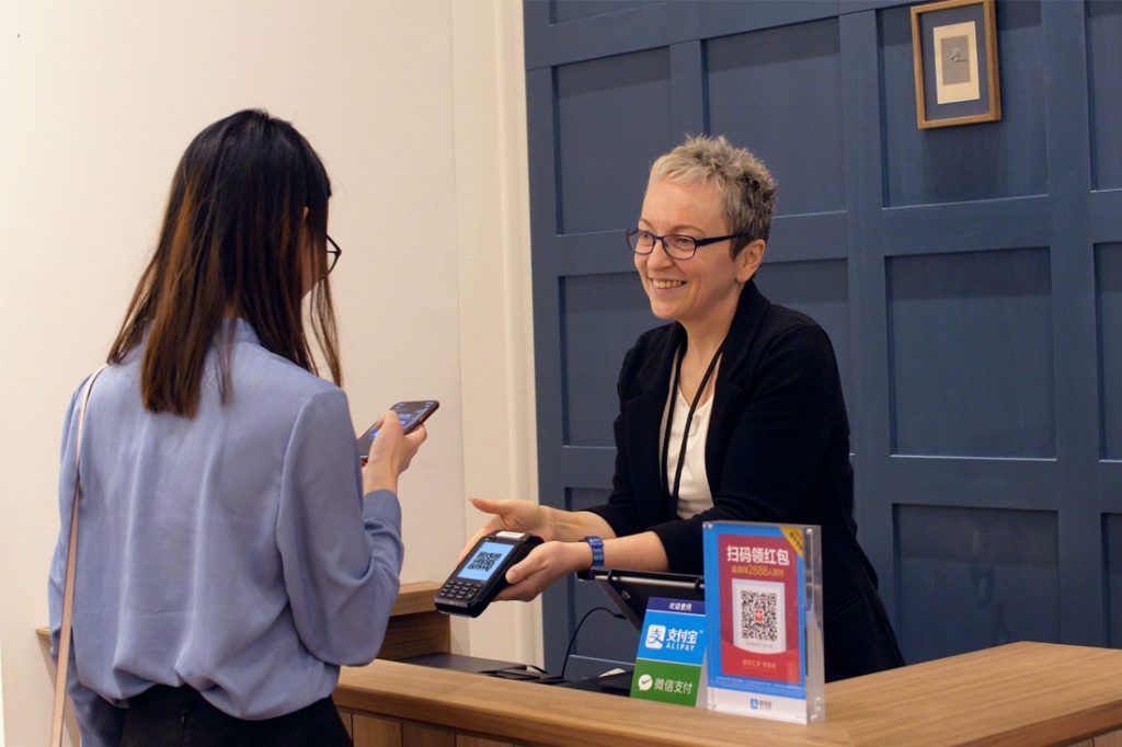 Customer paying at shop counter