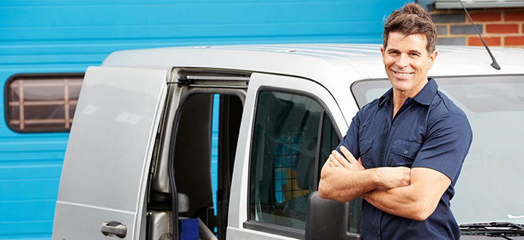 Man in front of van