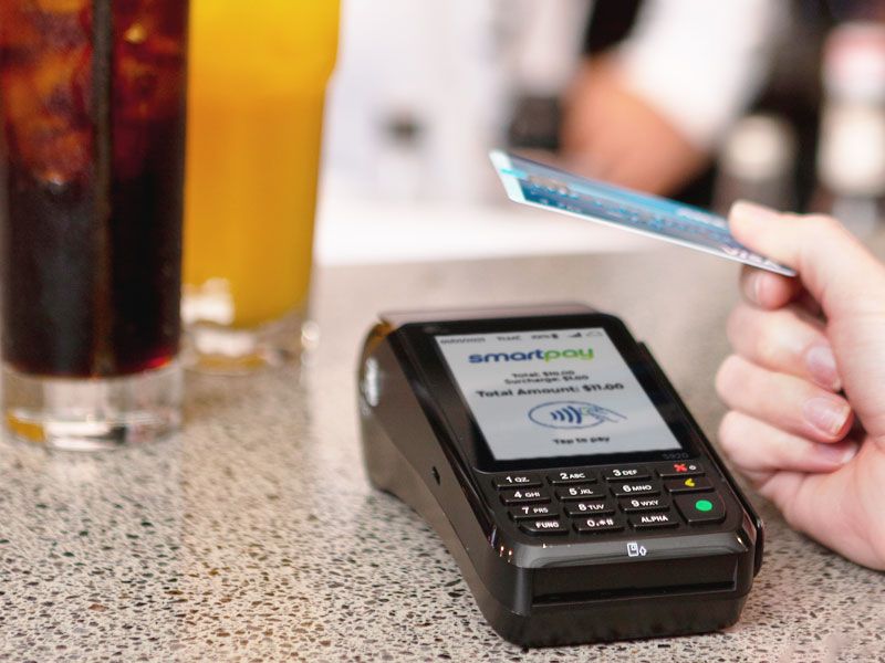 Contactless card payment on bar counter