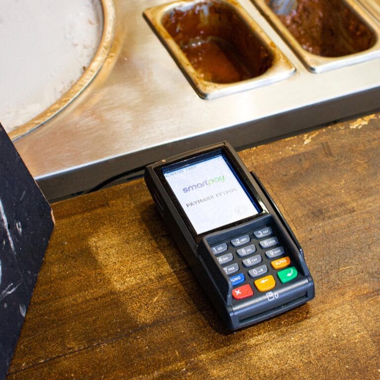 Smartpay terminal lying on ice cream shop counter