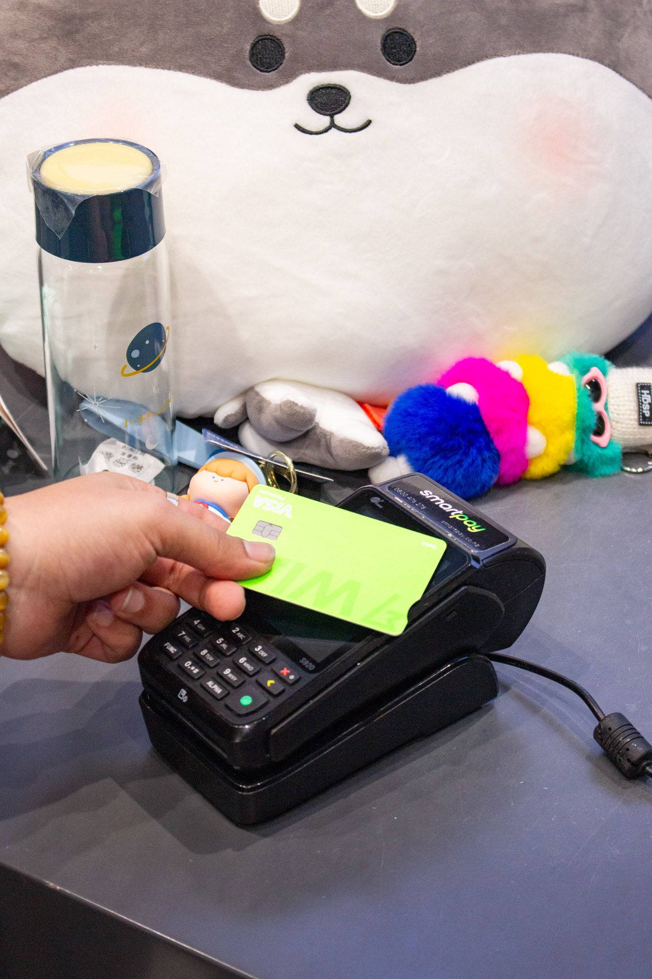 Paying with a card on a Smartpay EFTPOS terminal at YOYOSO.