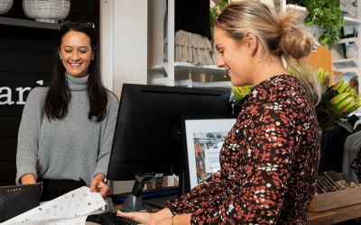 Lady paying for bag at counter