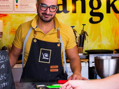 Bangkok Ice cream shop owner receiving payment on EFTPOS machine