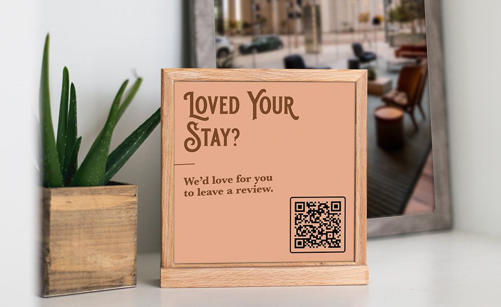 A table top banner asking for Google reviews.